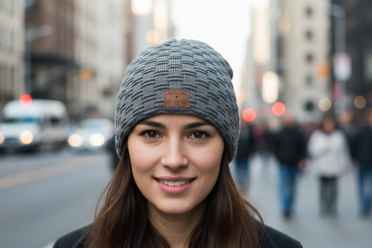 A gray knit hat with a Bluetooth headset integrated into the design.