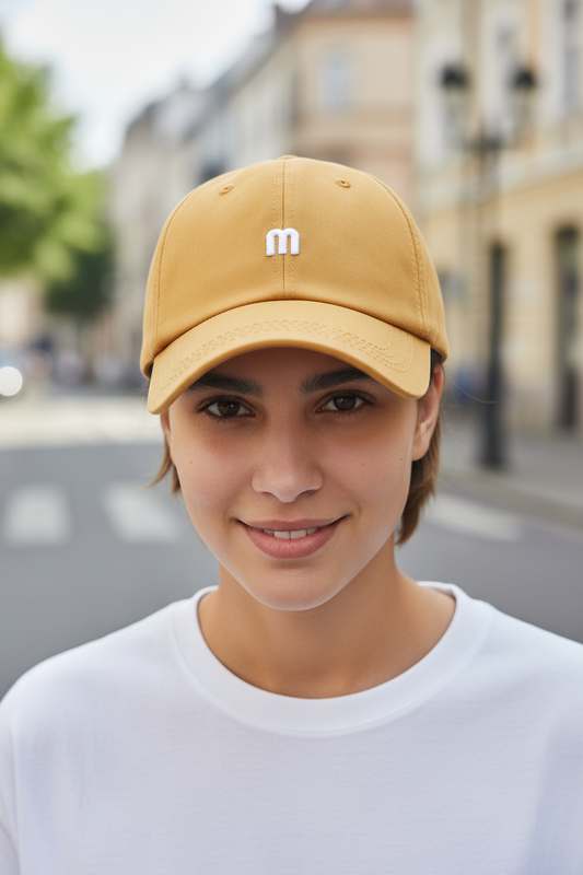 Yellow cap with a white 'm' logo on a white background