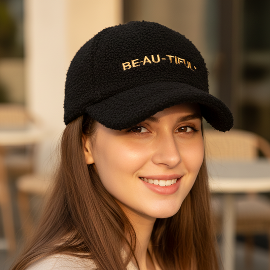 A collection of baseball caps in various colors with a wool material, featuring a dome shape and embroidered letters on the front.