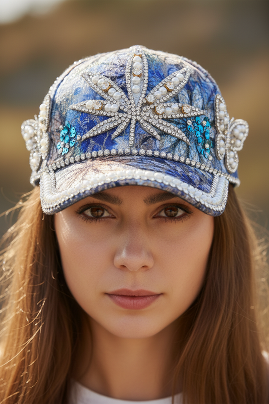 Decorative cap with floral pattern and embellishments on a white background