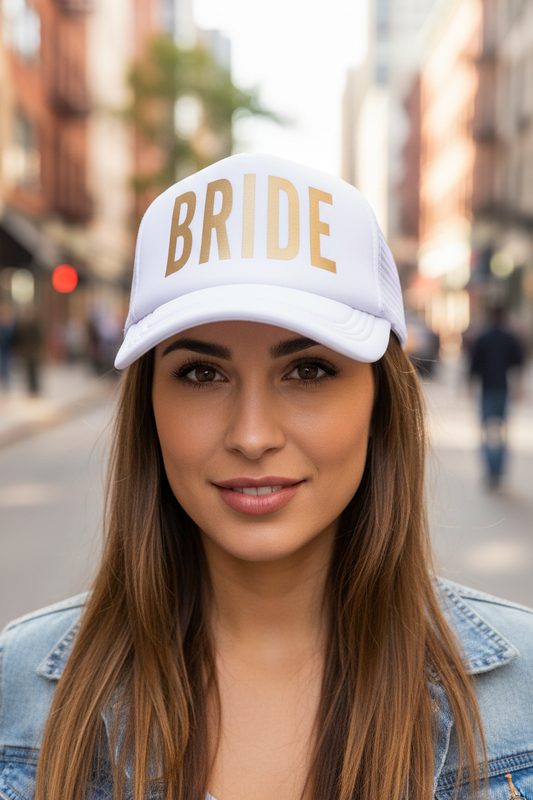 White cap with 'BRIDE' in gold letters on a white background