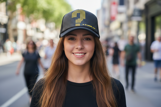 Black mesh cap with yellow lightning bolt design on a white background