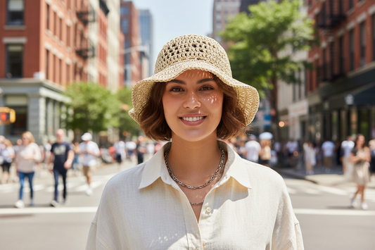 Beige woven sun hat on a light gray background