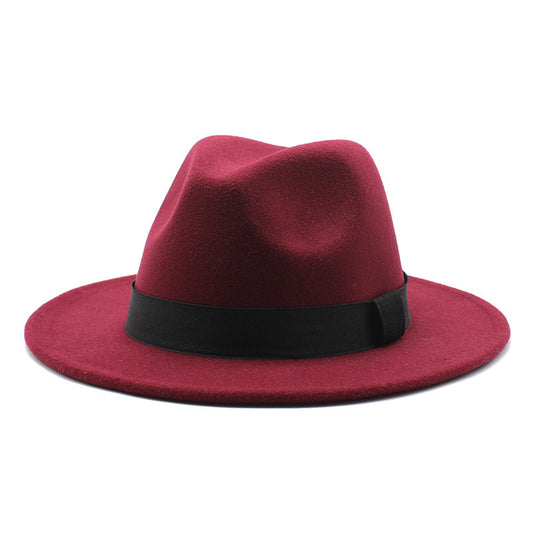 Red fedora hat with a black band on a white background