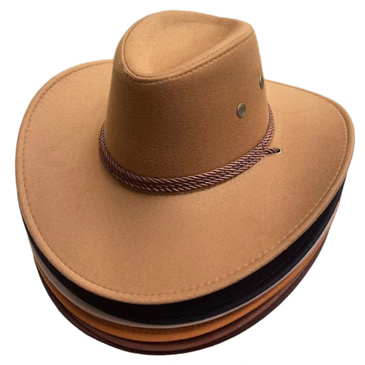 Brown cowboy hat with a braided band on a stone surface with grass in the background