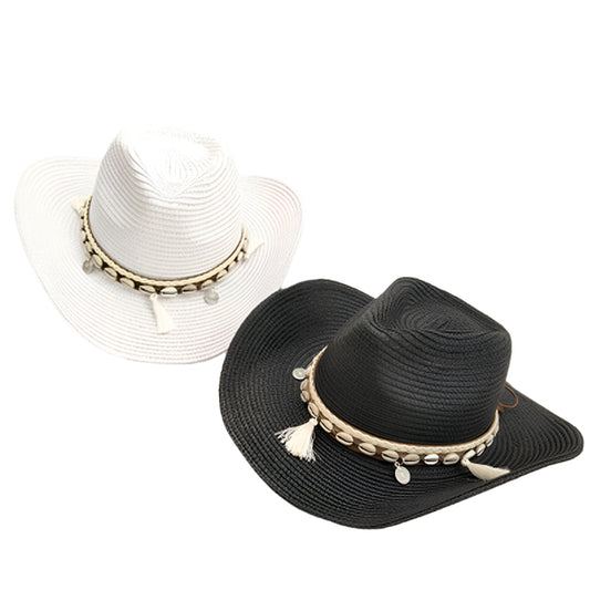White and black straw hats with decorative bands on a white surface.