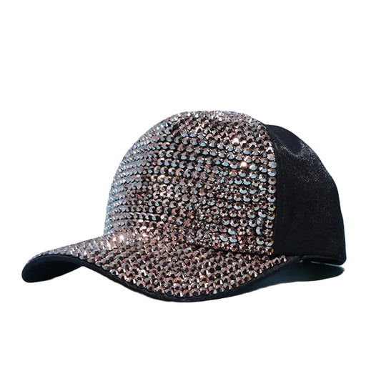 A collection of baseball caps in various colors, each adorned with rhinestones covering the entire surface.