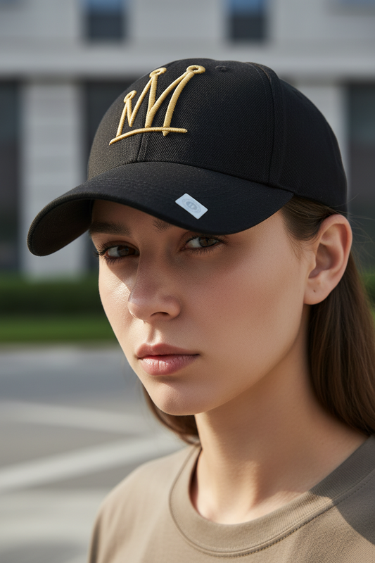 Black cap with a gold crown emblem on a white background