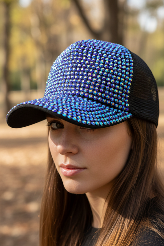 Black cap with multicolored rhinestone embellishments on a white background