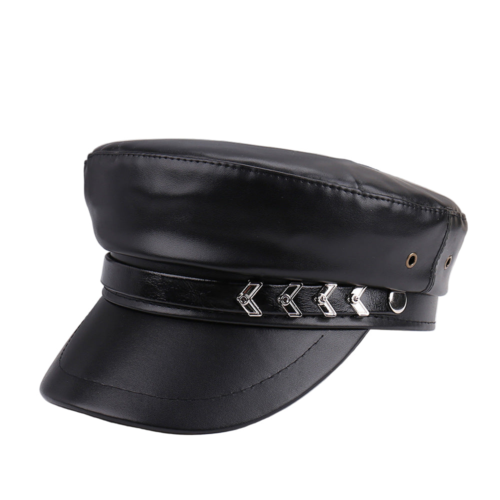 Black leather cap with decorative band on a white surface