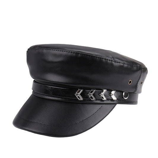 Black leather cap with decorative band on a white surface