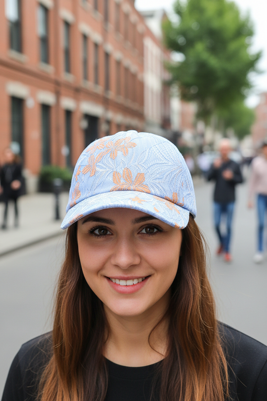 A blue baseball cap with a floral pattern in a processing technology display, likely made from polyester fiber.