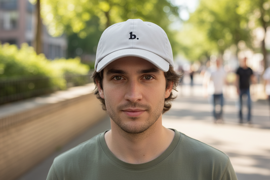 Gray baseball cap with a black logo on a white background