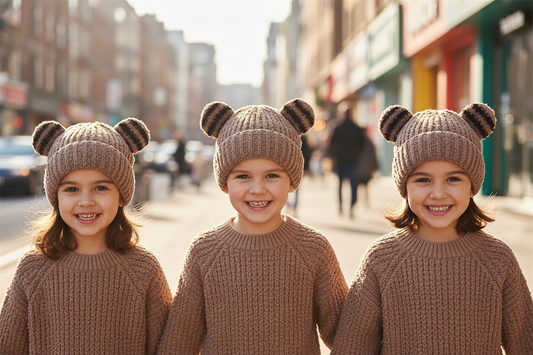 A collection of children's knitted hats with ear style stripes, available in beige, black, brown, and white colors.