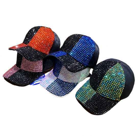 Three embellished caps on a wooden surface with a blurred background