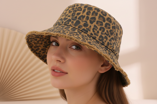Leopard print bucket hat on a light pink background